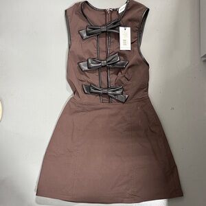 We’re what Elegant Brown Sleeveless Dress with Bow Accents